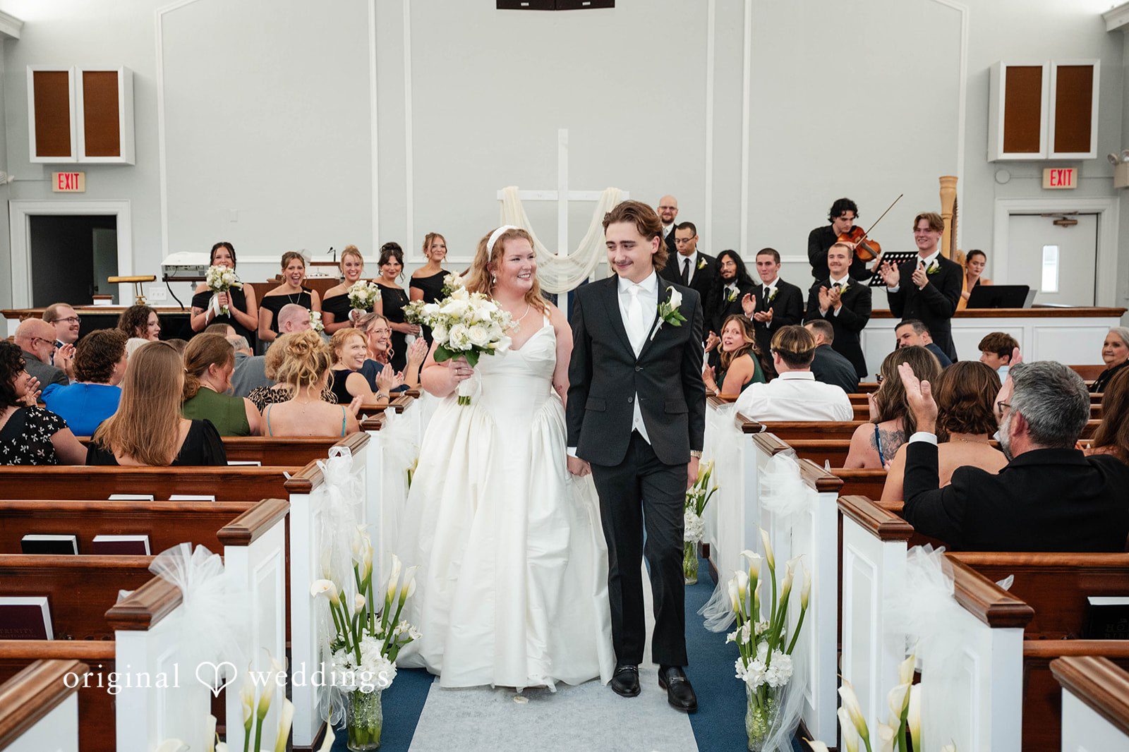Bethany + Eddie Wide view of the indoor church ceremony