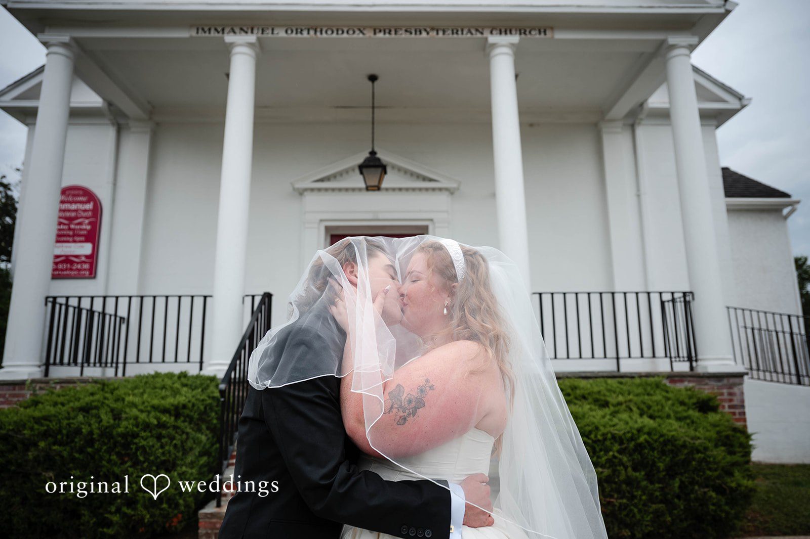 Bethany + Eddie Couple kissing on the church steps