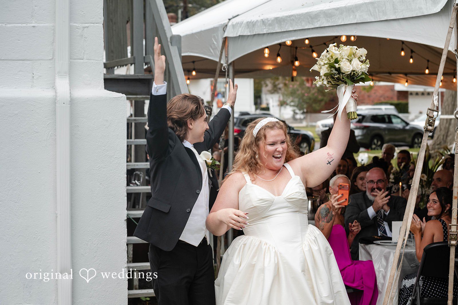 Bethany + Eddie Bride waving during the reception entrance