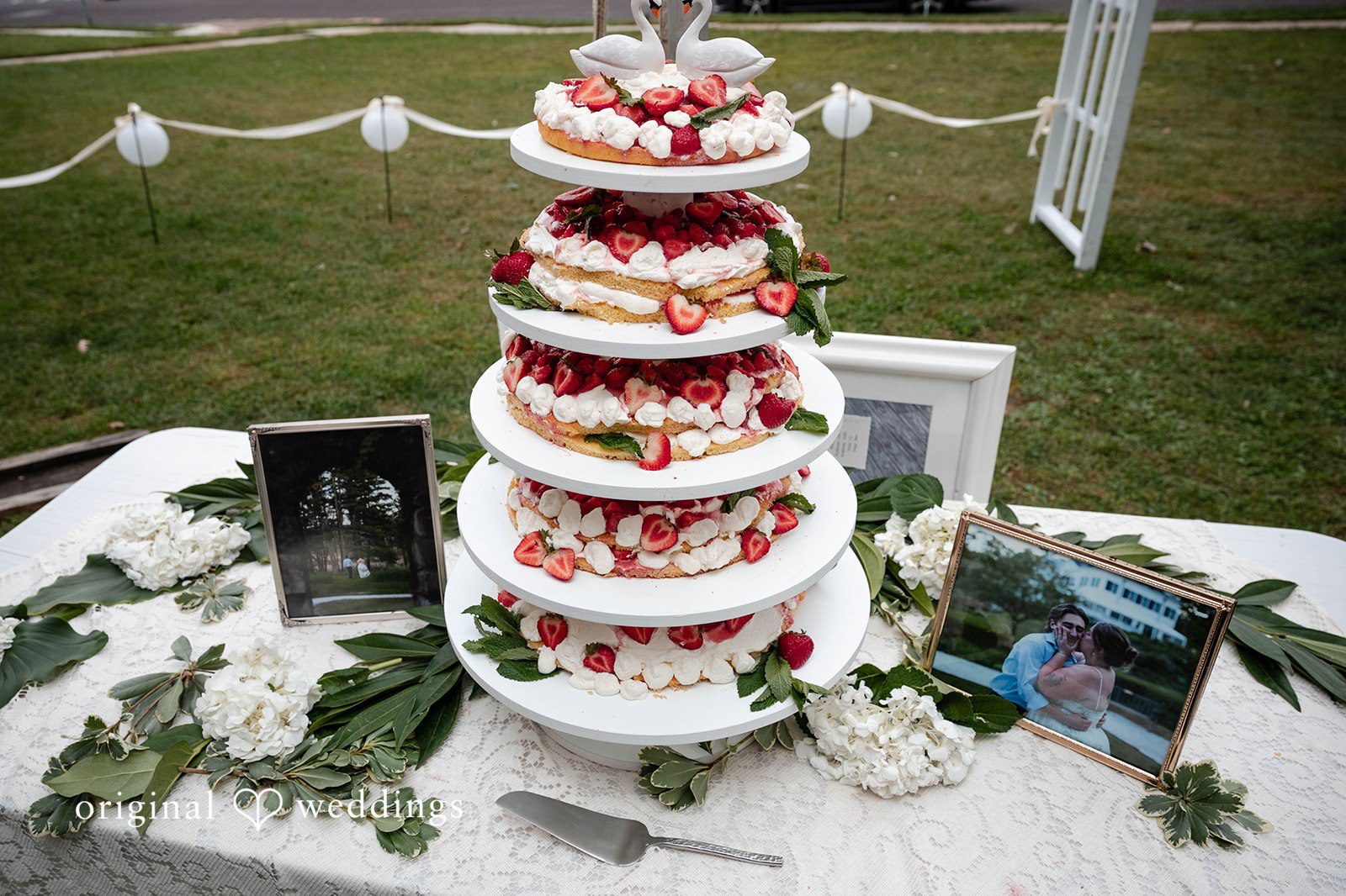 Bethany + Eddie Tiered wedding cake with red florals