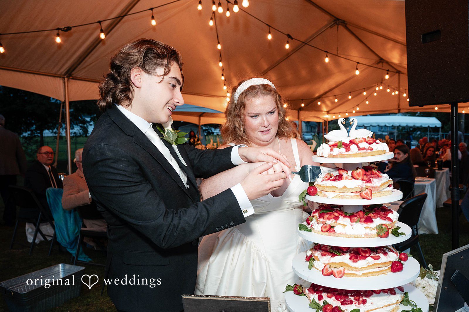Bethany + Eddie Couple cutting the wedding cake