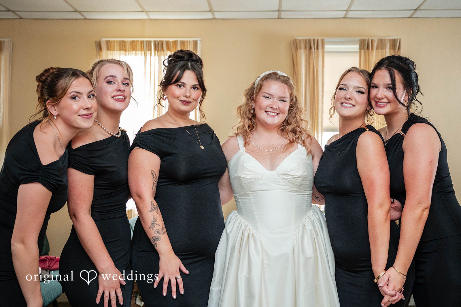 Bethany + Eddie Bride with her bridesmaids in black dresses
