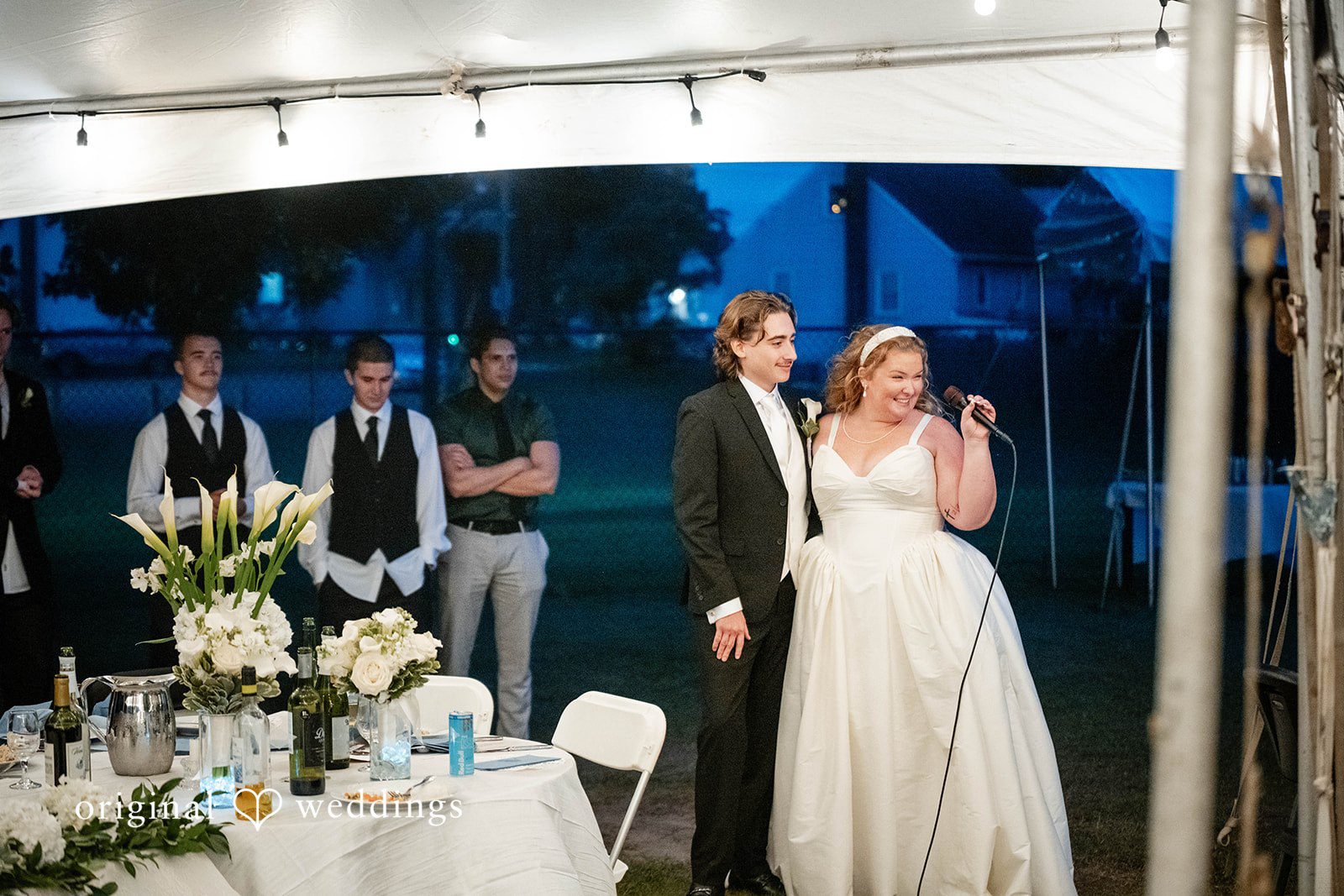 Bethany + Eddie Couple entering the reception tent