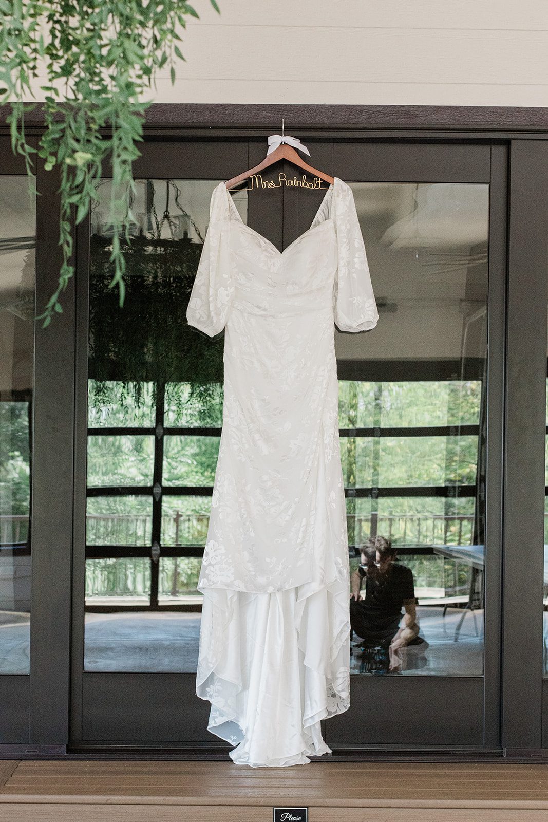 innsbrook-resort-airy-st-louis-sophia-brendan-p007-07 Wedding dress hanging by the window at Innsbrook Resort