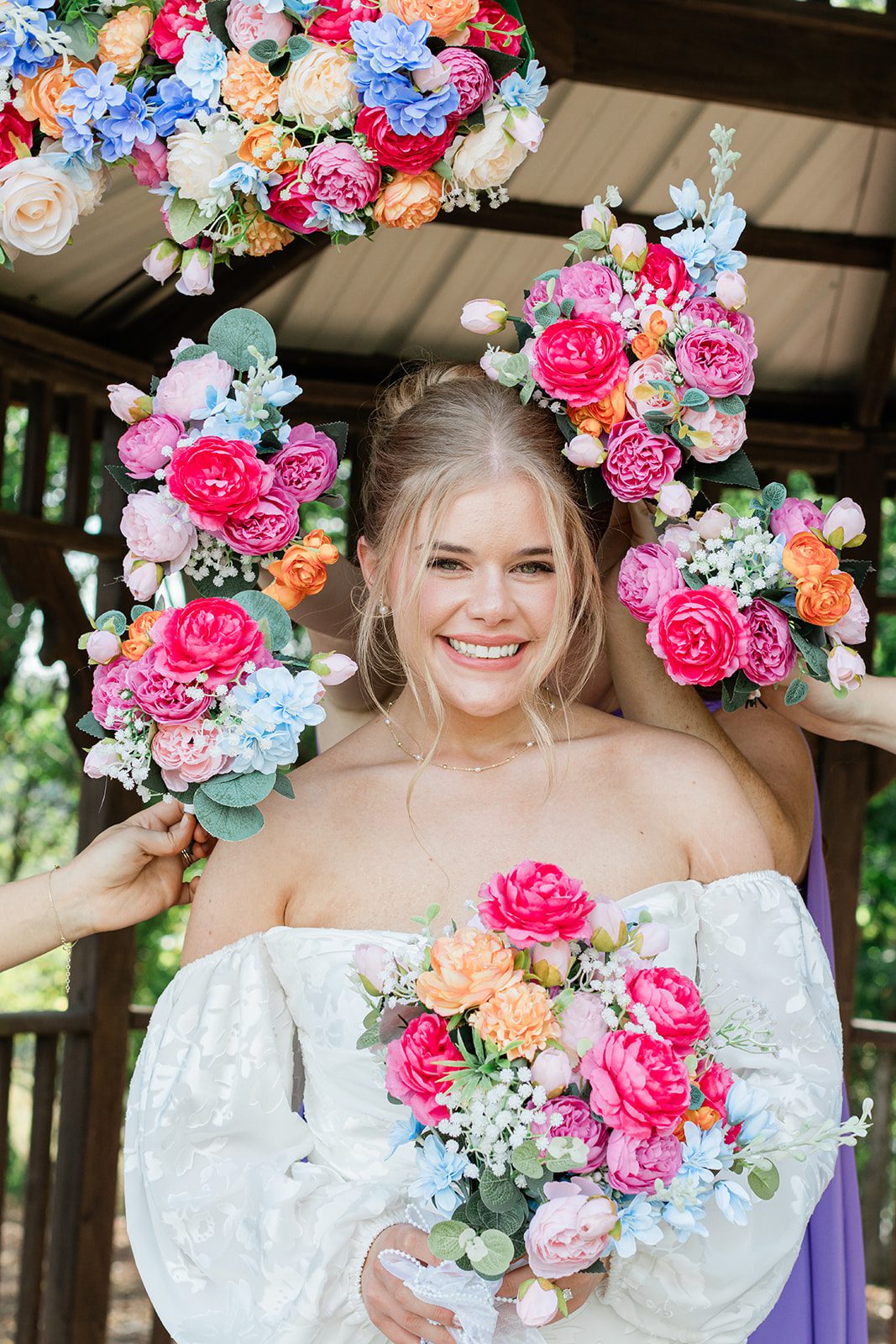 innsbrook-resort-airy-st-louis-sophia-brendan-p012-10 Bride framed by bright pink and orange flowers