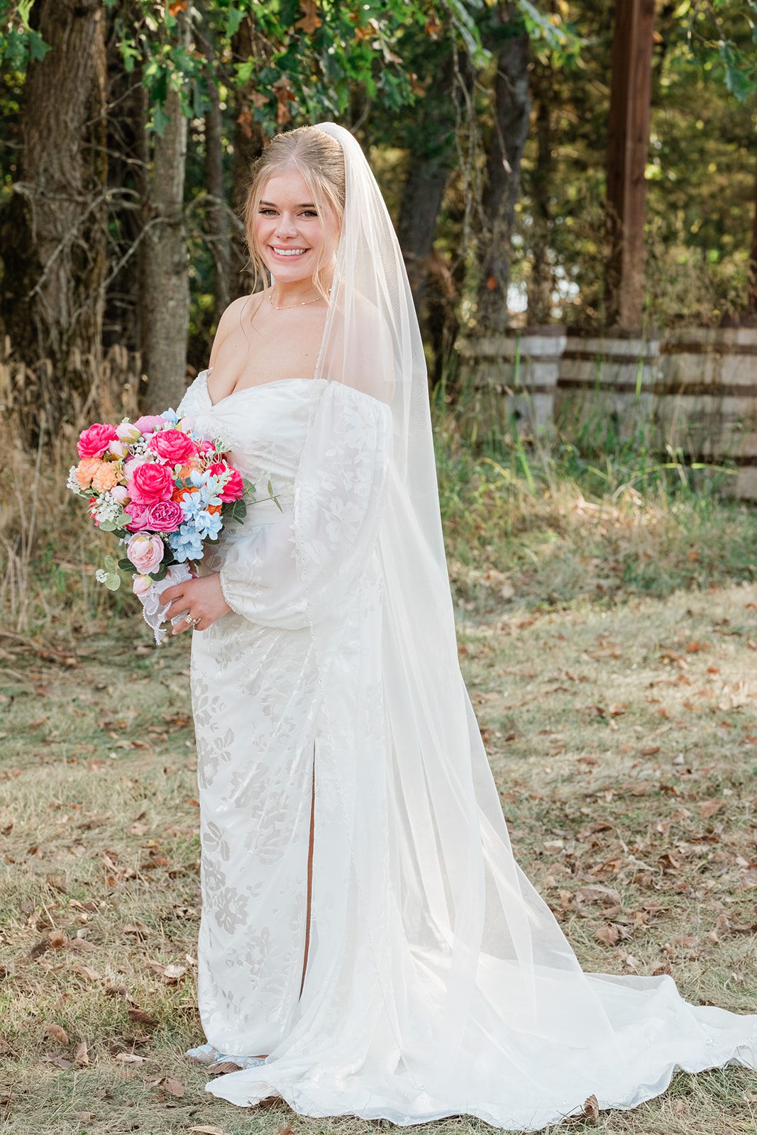 innsbrook-resort-airy-st-louis-sophia-brendan-p013-13 Bride holding her bouquet in the woods