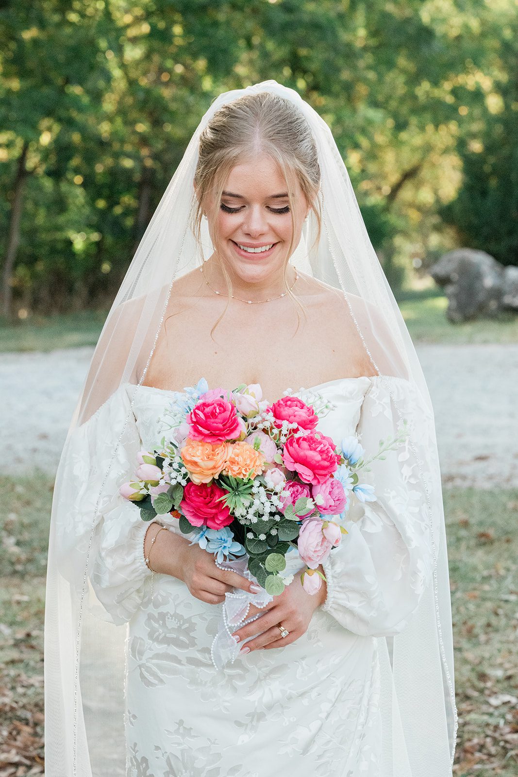 innsbrook-resort-airy-st-louis-sophia-brendan-p014-04 Bride smiling with her colorful bouquet
