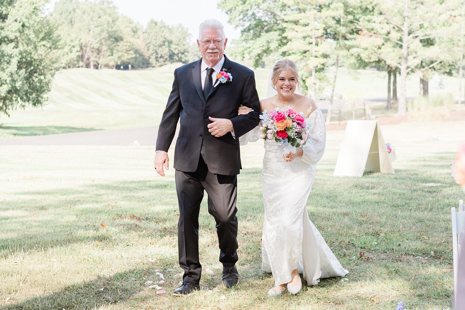 innsbrook-resort-airy-st-louis-sophia-brendan-p018-10 Bride walking down the aisle with a loved one