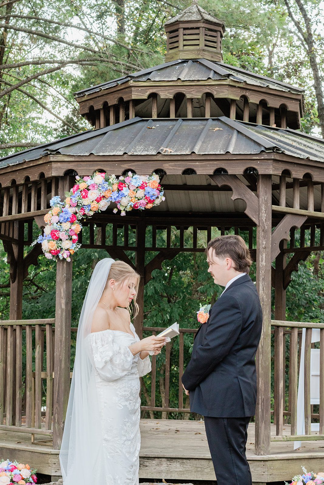 innsbrook-resort-airy-st-louis-sophia-brendan-p019-07 Ceremony under the flower covered gazebo at Innsbrook Resort
