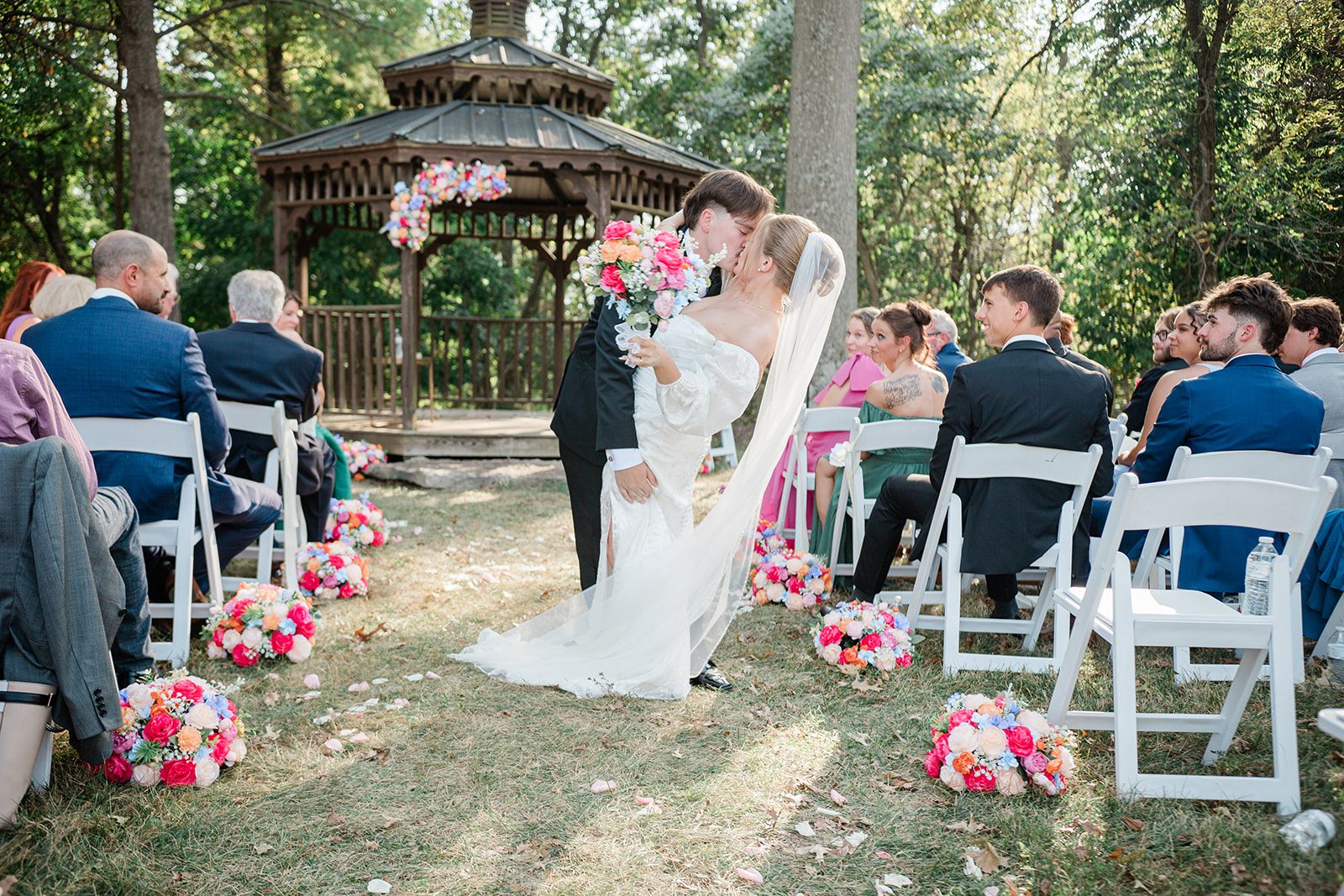 innsbrook-resort-airy-st-louis-sophia-brendan-p022-05 First kiss at the outdoor ceremony at Innsbrook Resort