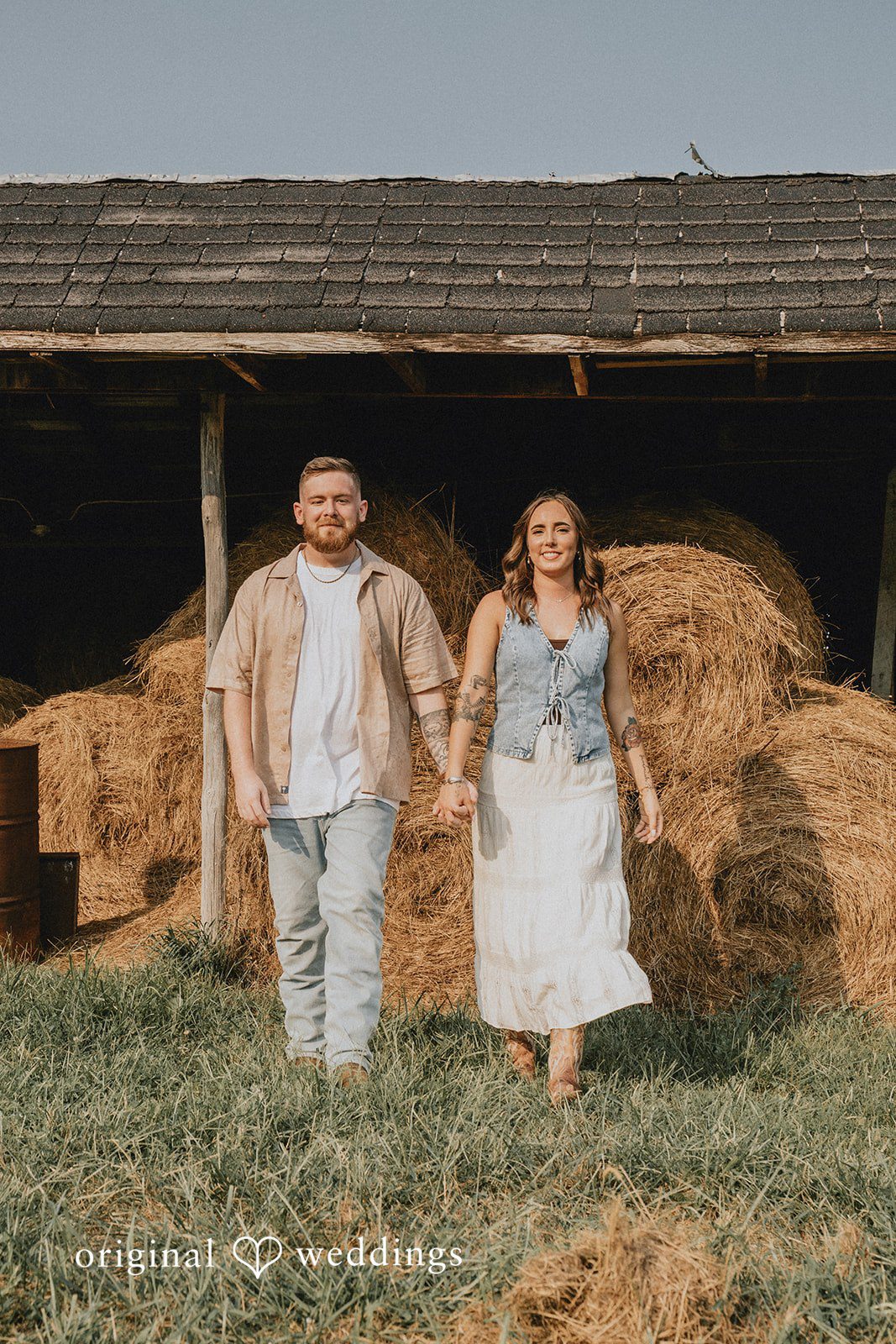 Emily + Elijah Our Cincinnati engagement photographers captured a stunning portrait of the couple by the field