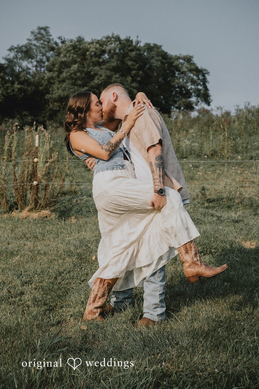 Emily + Elijah The couple shares a romantic kiss