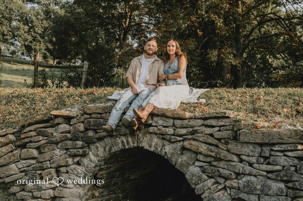 Emily + Elijah Our Cincinnati engagement photographers captured a stunning portrait of the couple by the stone bridge in their Kentucky backyard