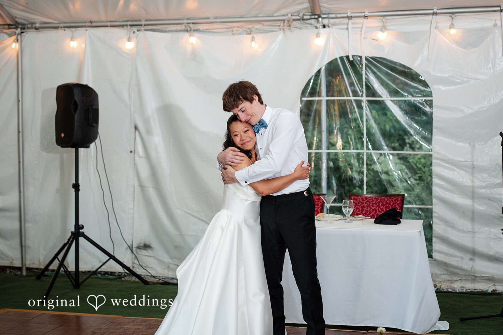 Mae + Corey • A bride and groom share a close embrace on the dance floor during their wedding reception.