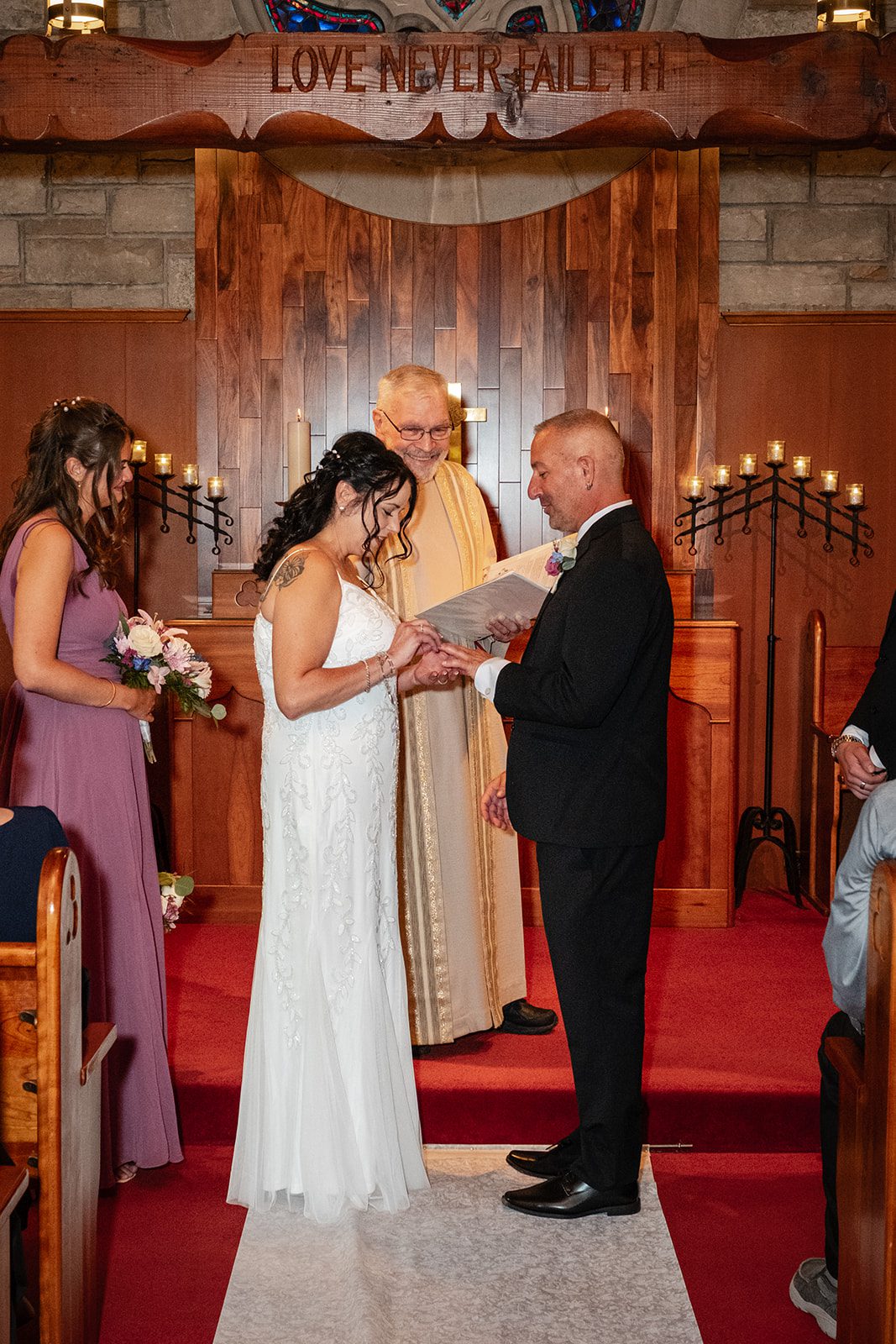 Couple at the altar during the ceremony Couple at the altar during the ceremony
