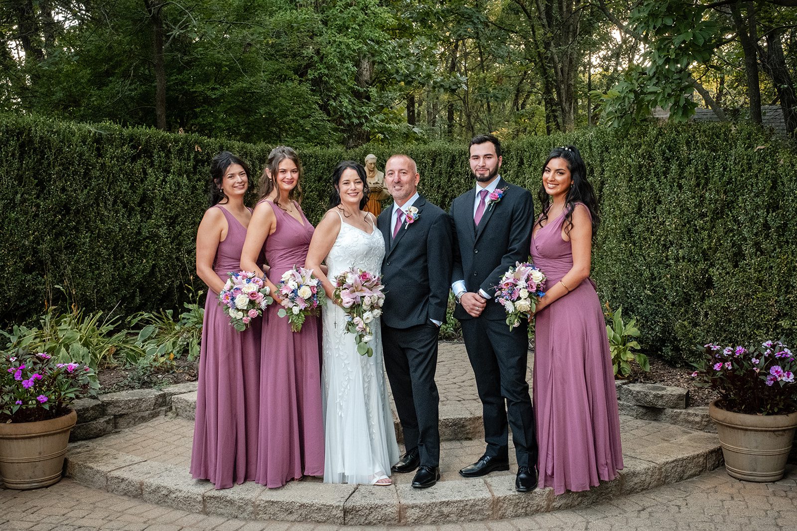 Bride with her bridesmaids in mauve Bride with her bridesmaids in mauve