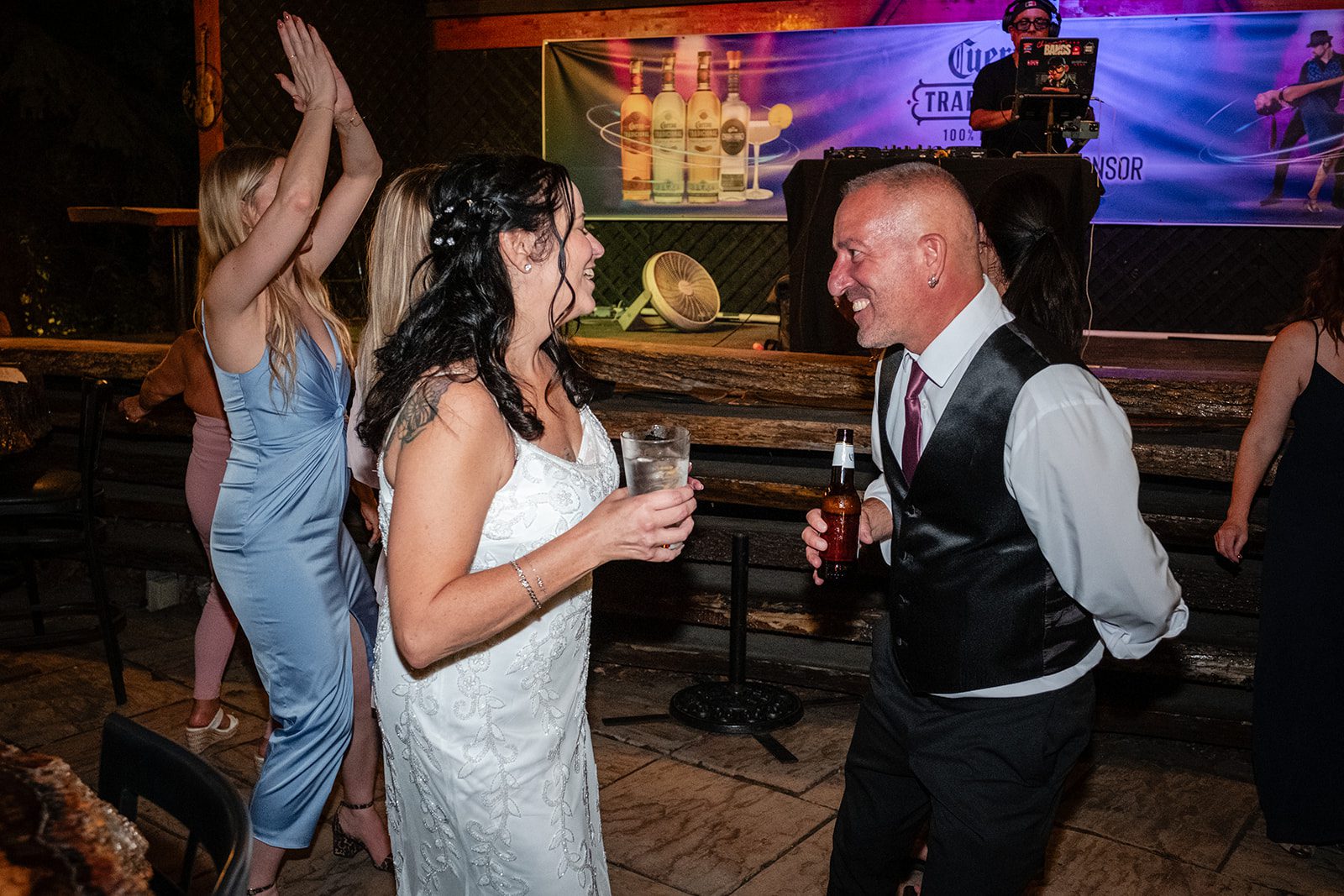 Guests dancing with the couple Guests dancing with the couple