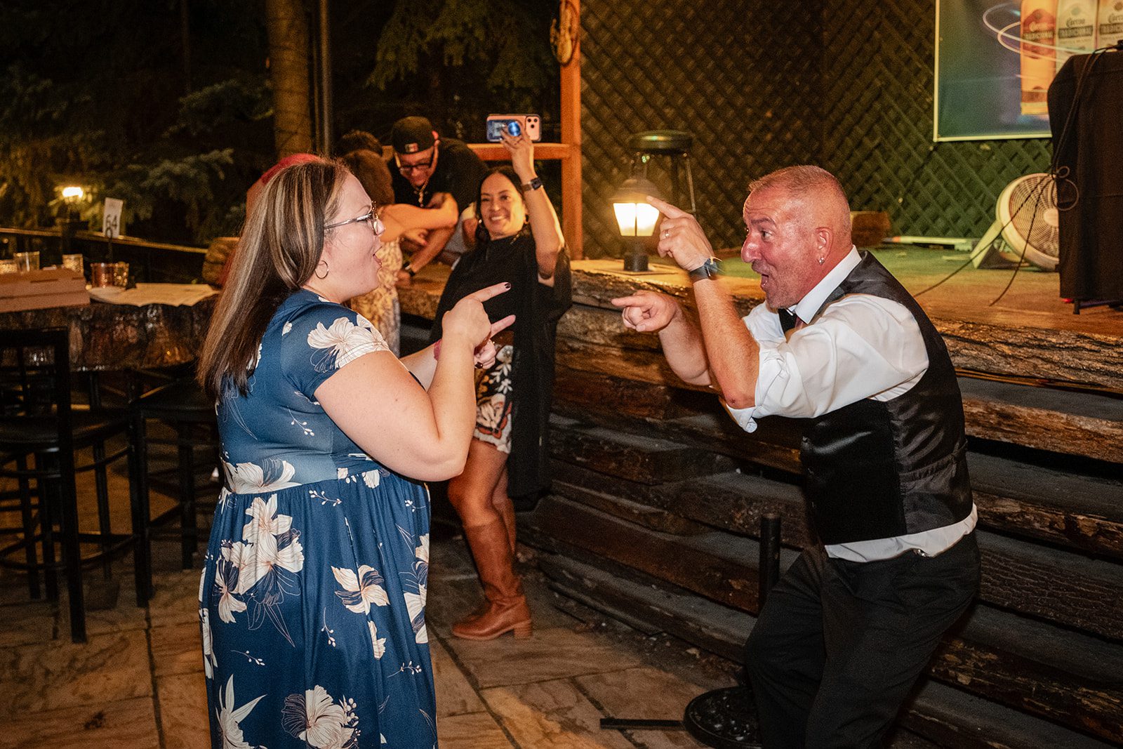 Groom dancing with a guest Groom dancing with a guest
