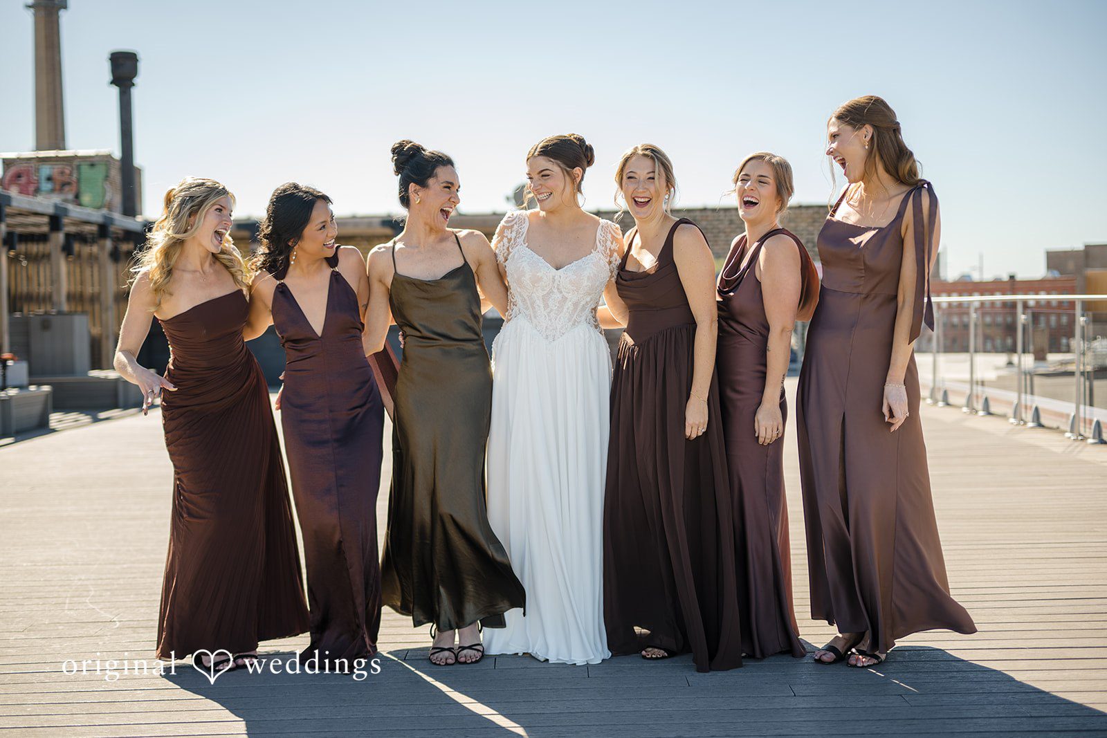 Michael + Haley Bride with her bridesmaids on the rooftop