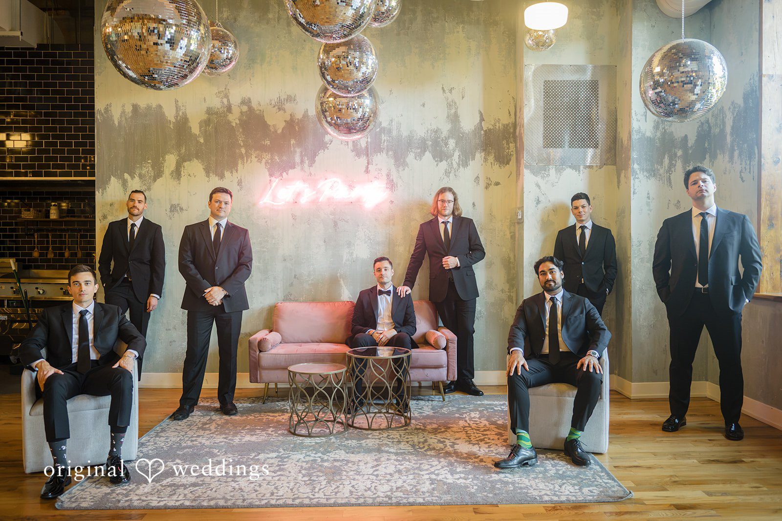 Michael + Haley Groom and groomsmen on the lounge couch