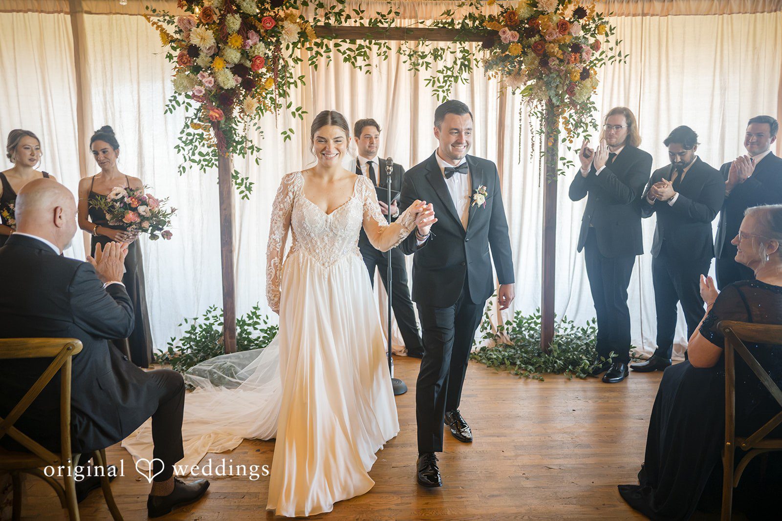 Michael + Haley Couple walking back up the aisle