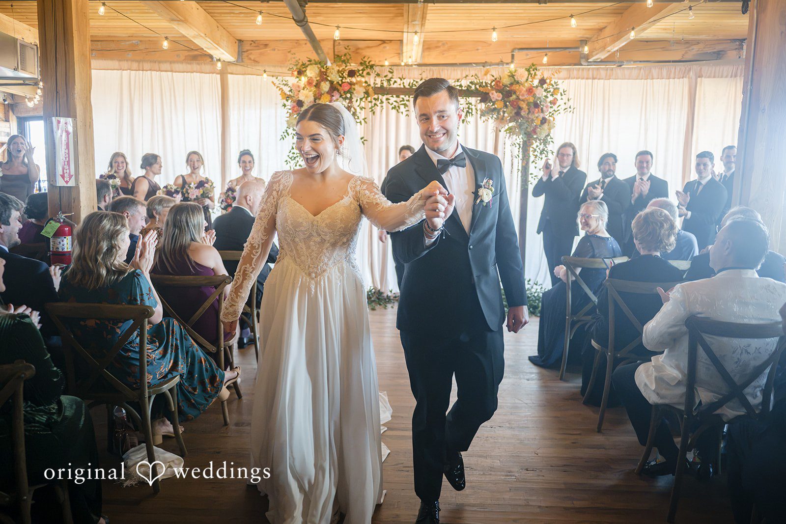 Michael + Haley Bride walking down the aisle past guests