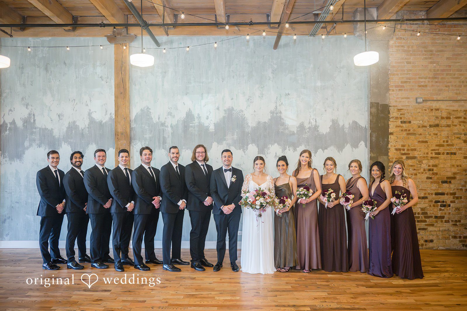 Michael + Haley Full wedding party lined up in the loft at Lacuna Lofts
