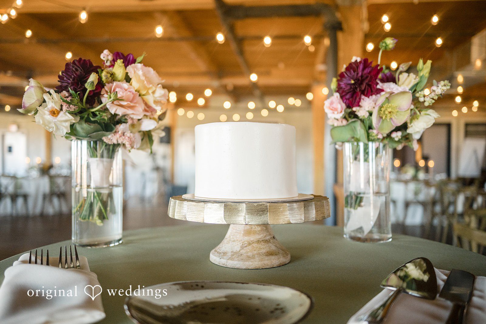 Michael + Haley Wedding cake on a floral table at Lacuna Lofts