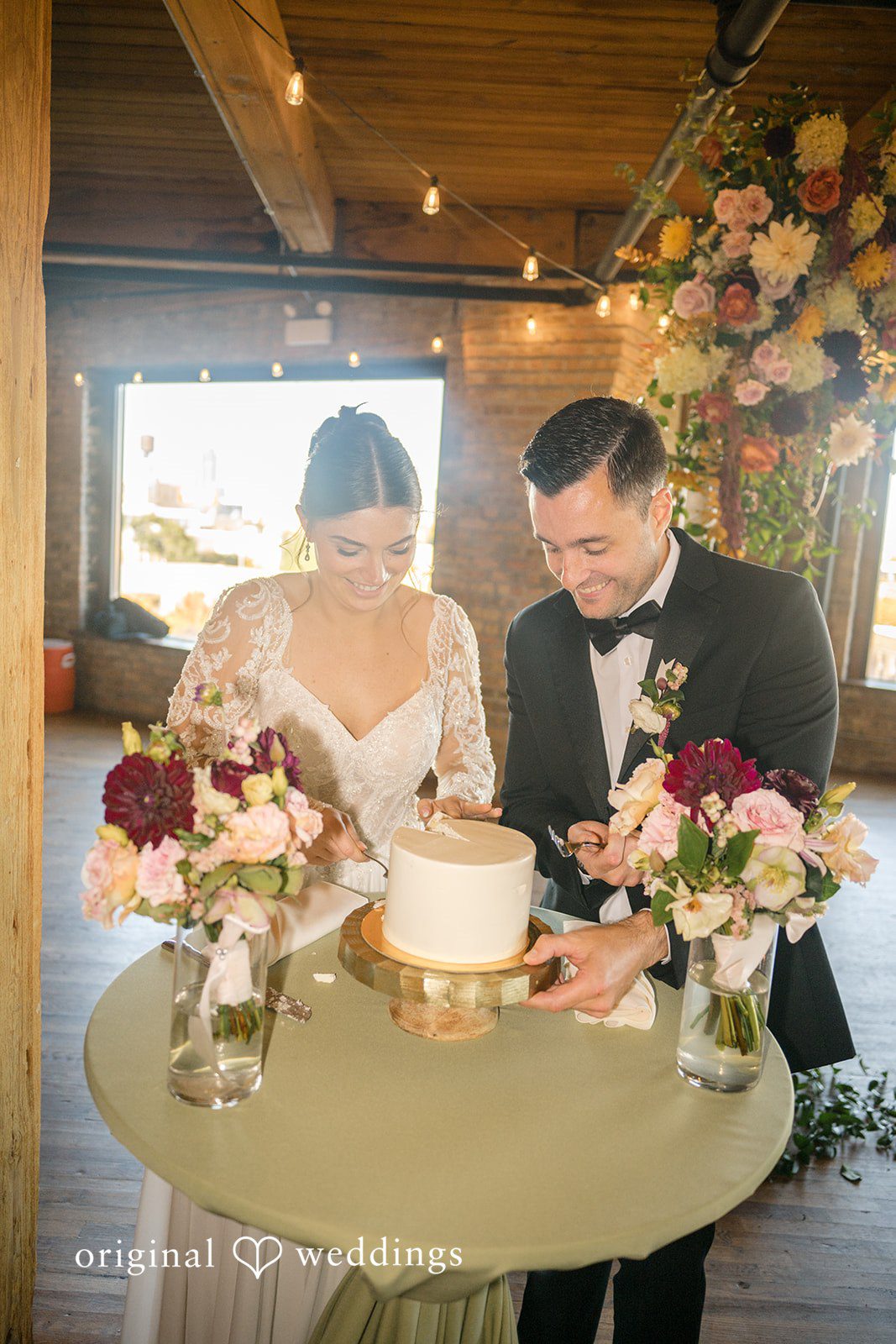 Michael + Haley Couple cutting the wedding cake