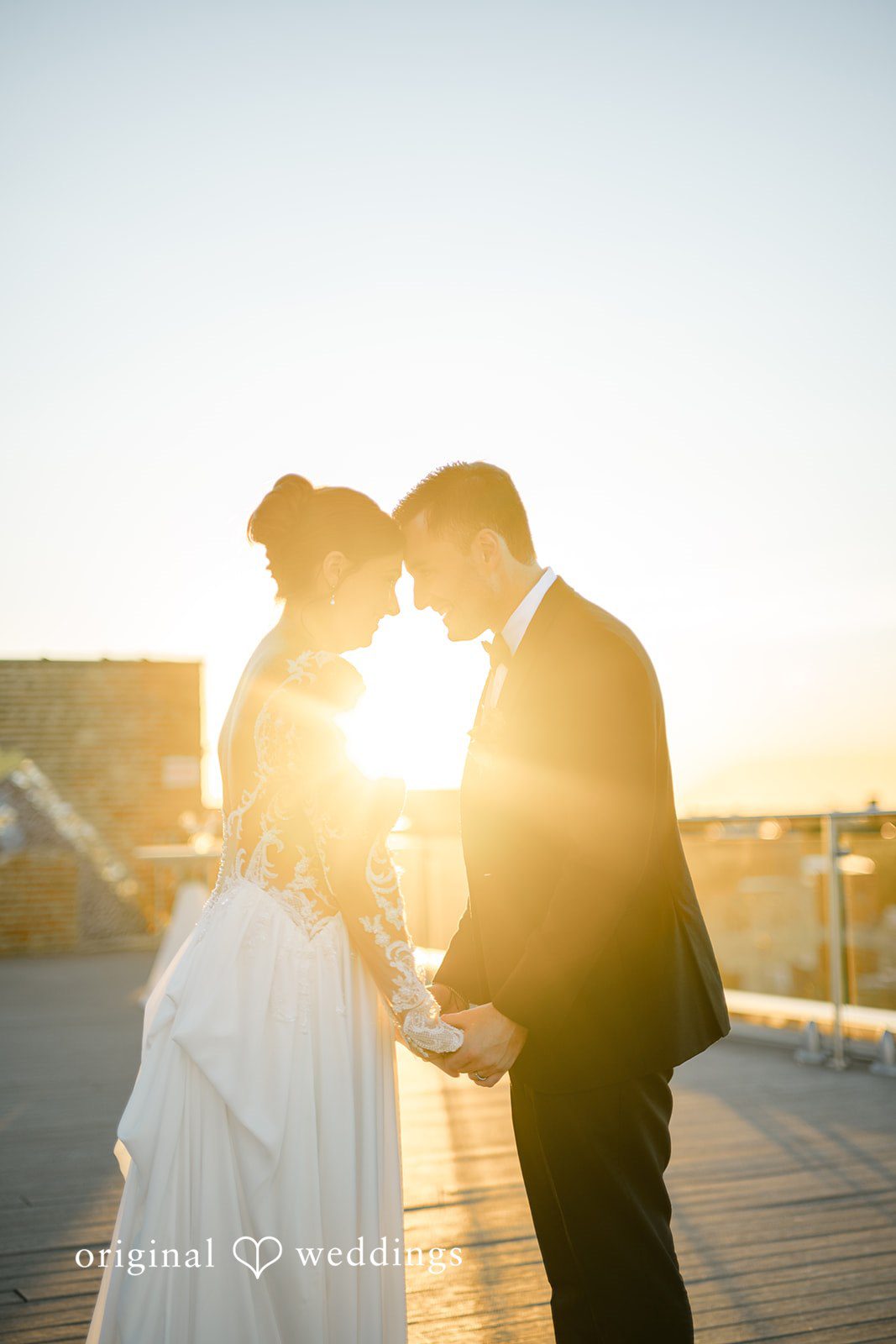 Michael + Haley Couple kissing in the golden sunset light