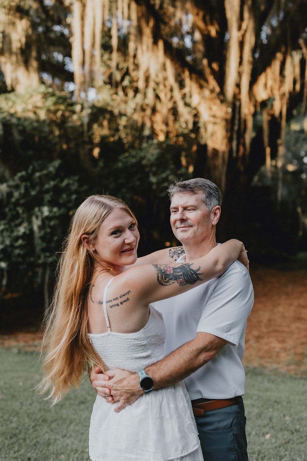 legare-waring-house-rustic-charleston-kaylee-nick-p011-11 Couple laughing together in golden light