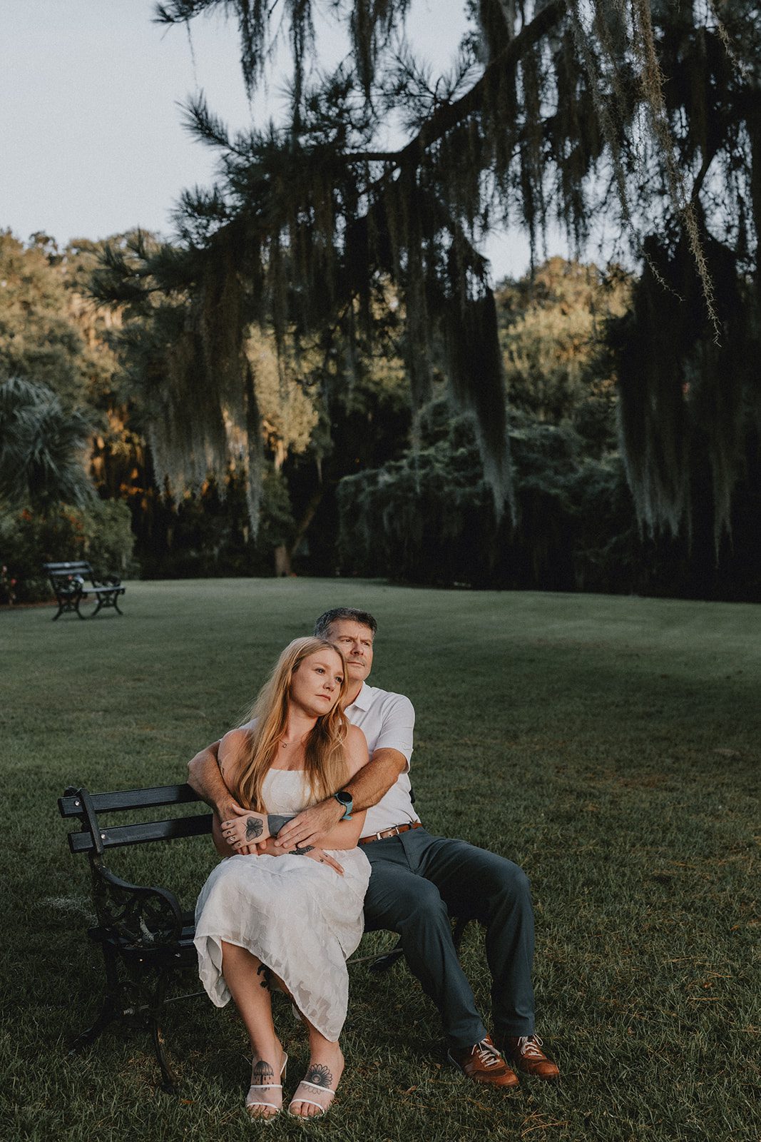 legare-waring-house-rustic-charleston-kaylee-nick-p015-08 Couple sitting together on the grass