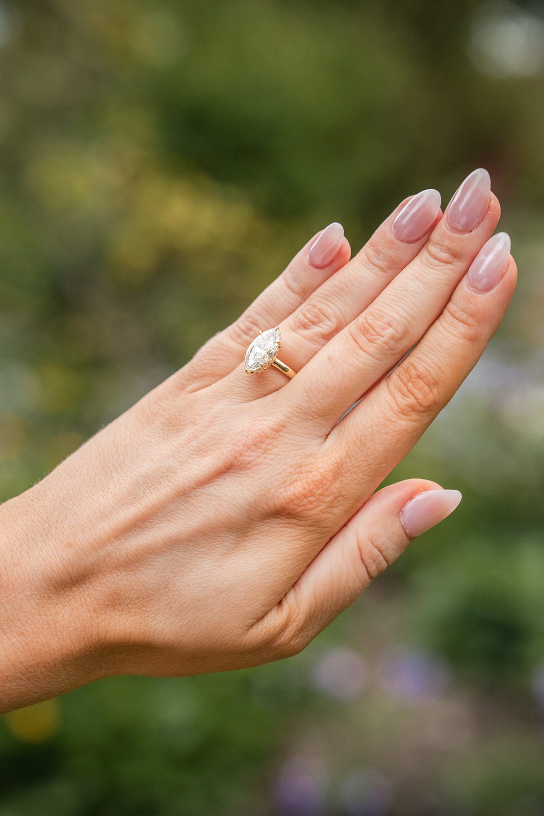 lilacia-park-timeless-chicago-dimitri-alexys-p001-06 Close up of the engagement ring among the flowers
