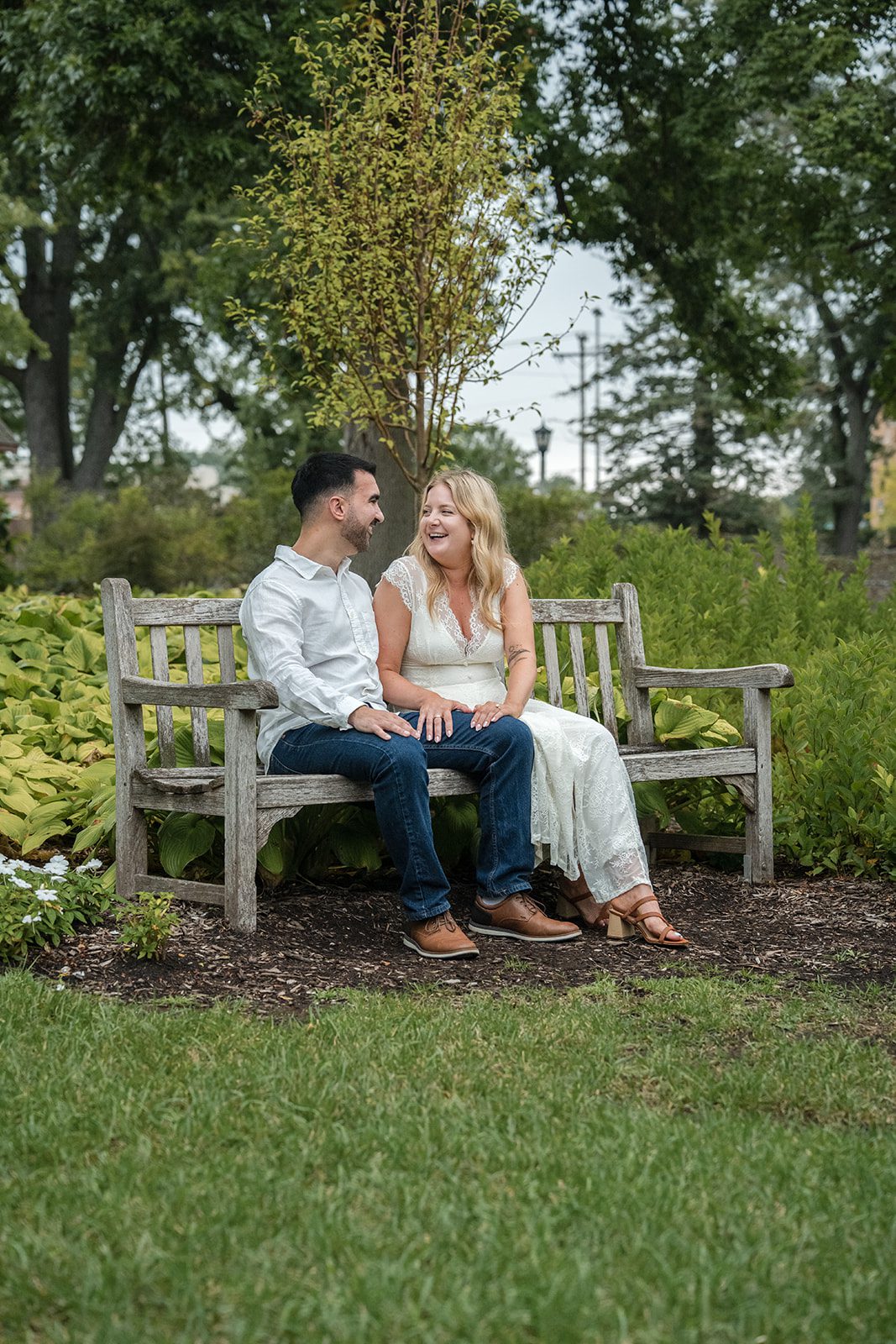 lilacia-park-timeless-chicago-dimitri-alexys-p014-19 Wide view of the couple on the bench among the trees