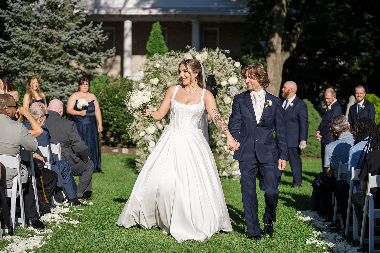 linwood-estate-timeless-baltimore-autumn-dylan-026-37 Newlyweds walking back up the aisle after their outdoor ceremony