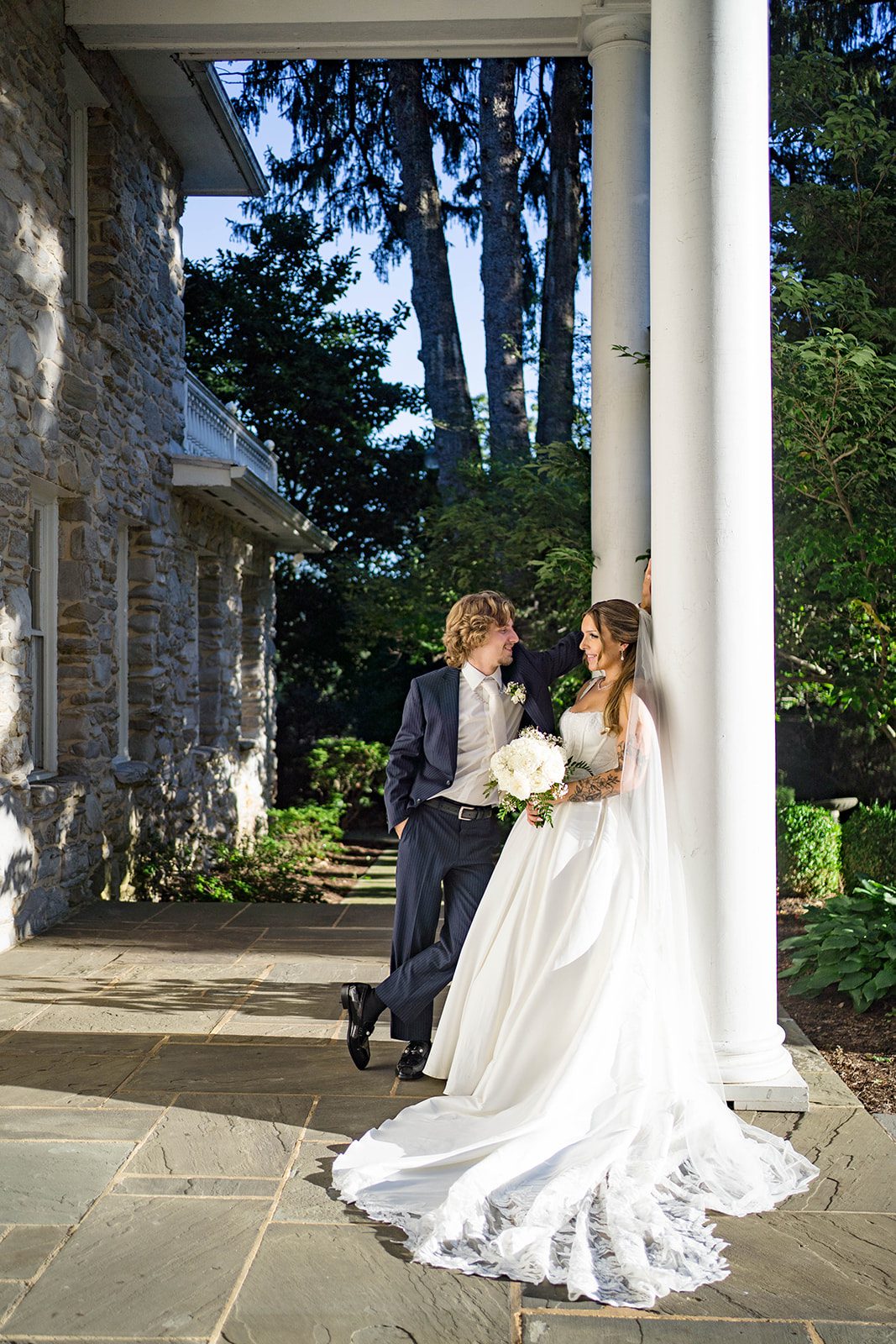 linwood-estate-timeless-baltimore-autumn-dylan-033-25 Bride and groom by the mansion columns