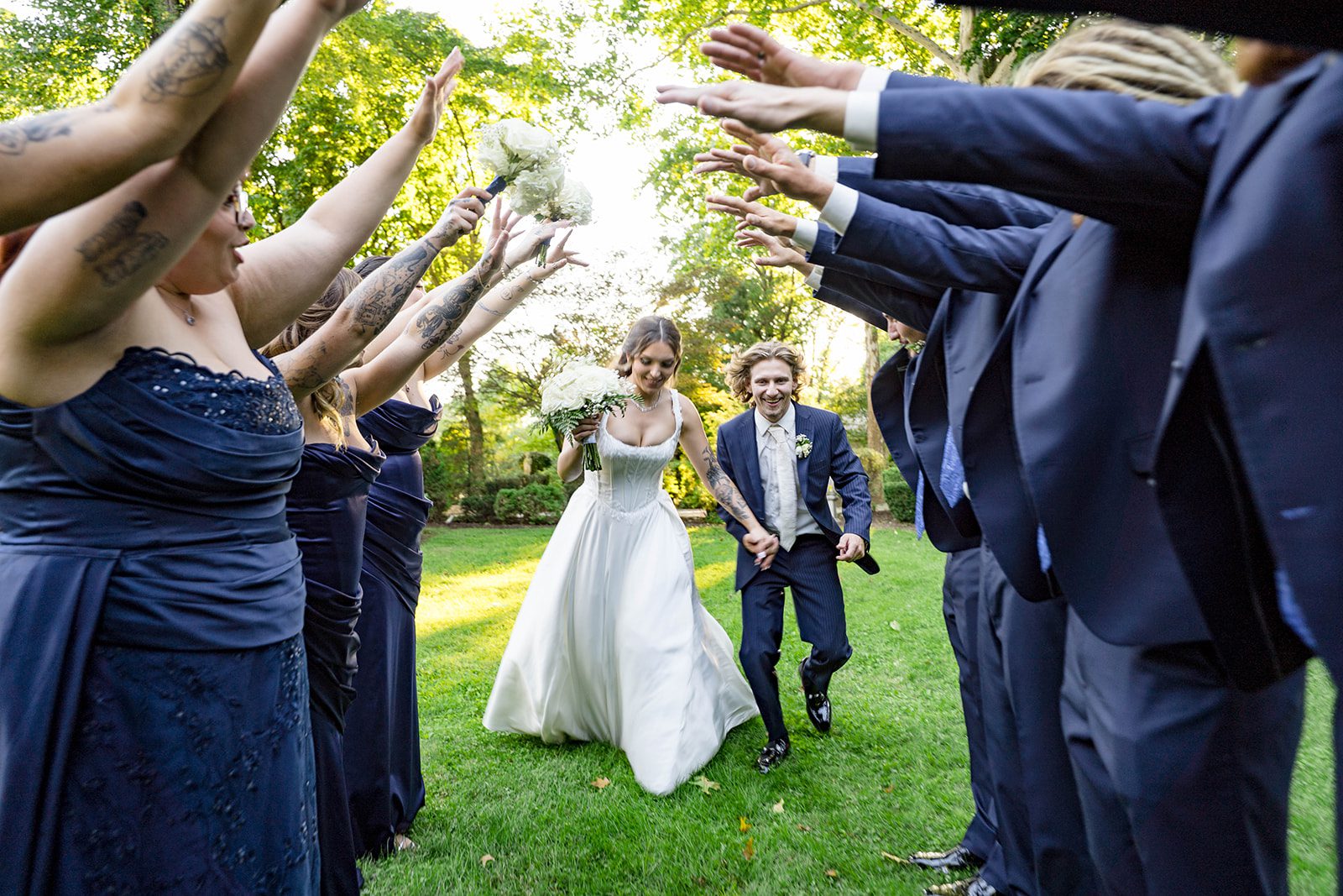linwood-estate-timeless-baltimore-autumn-dylan-046-27 Wedding party cheering with the couple