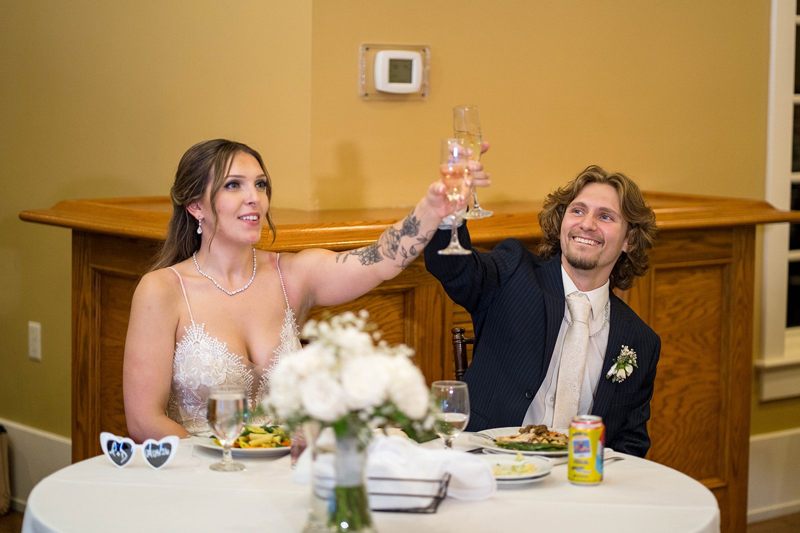 linwood-estate-timeless-baltimore-autumn-dylan-049-11 Bride and groom toasting at their sweetheart table
