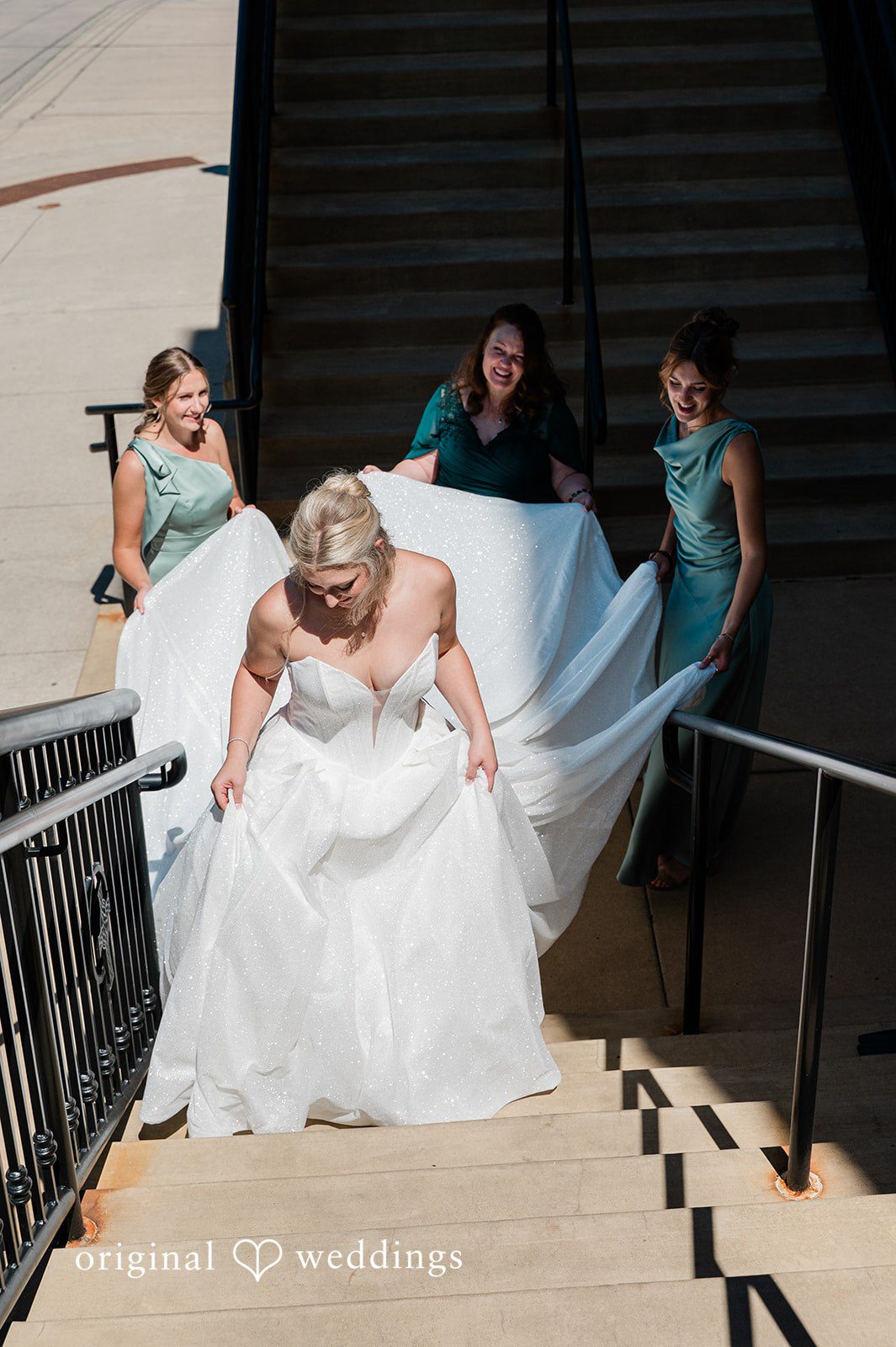 Claire + Alex The bride walks through the stairs