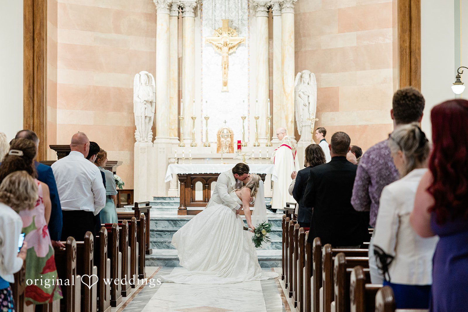 Claire + Alex Passionate kiss on the aisle