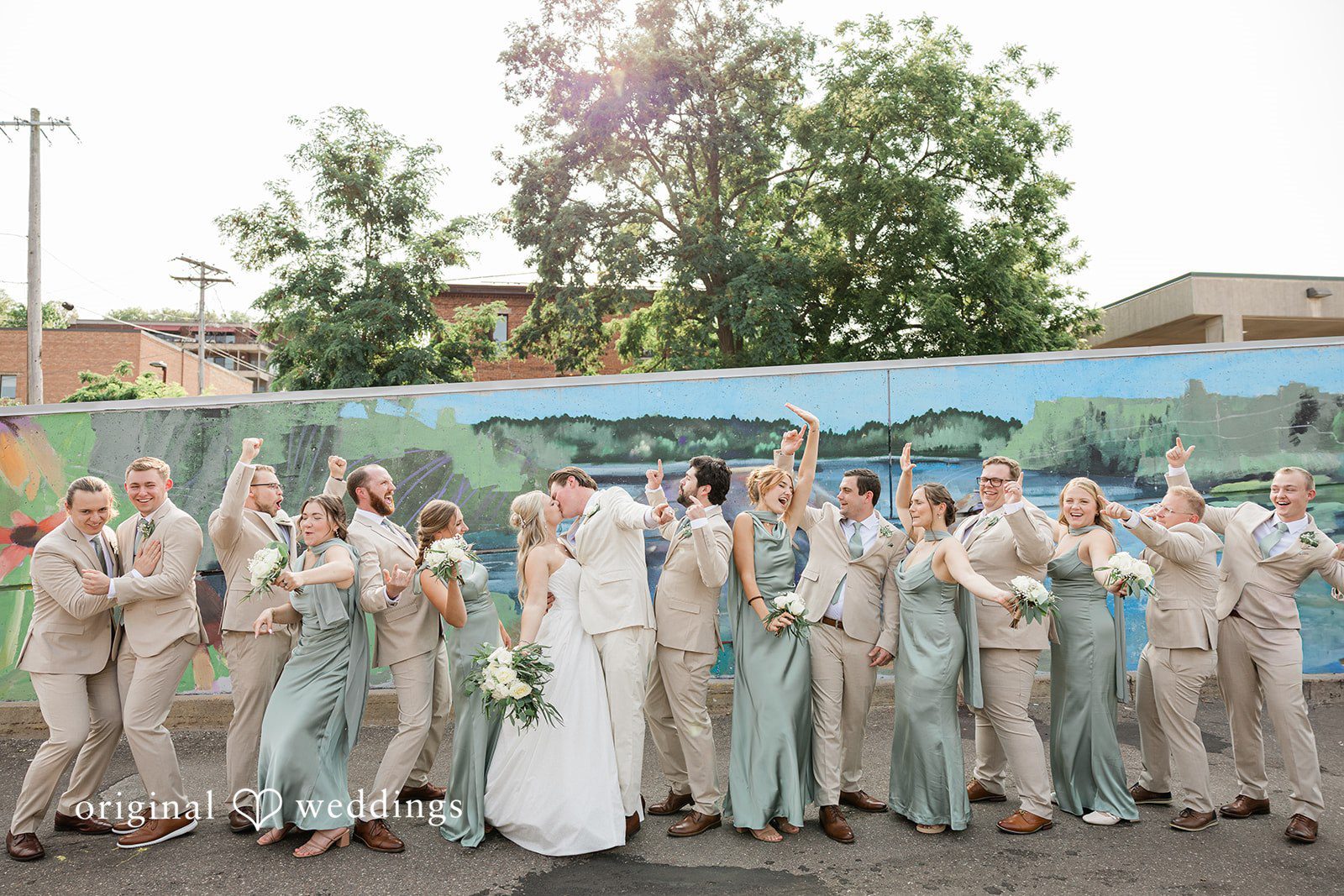 Claire + Alex Fun portrait of the couple and their bridal party
