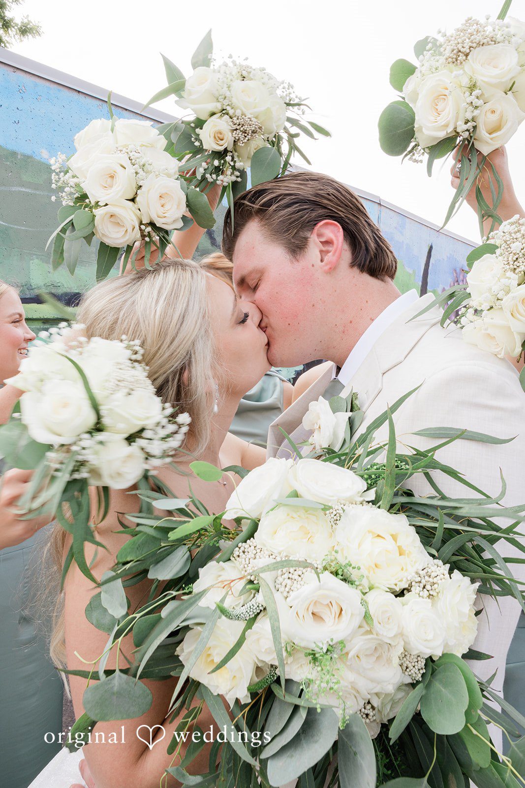 Claire + Alex The couple shares a kiss