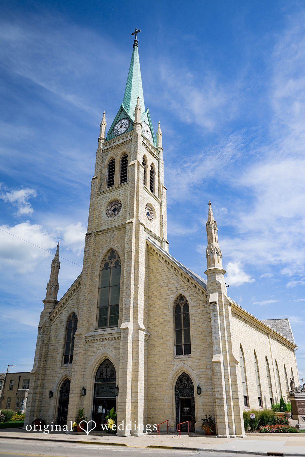 Sierra + Arturo Gothic church exterior with tall steeple on a sunny day