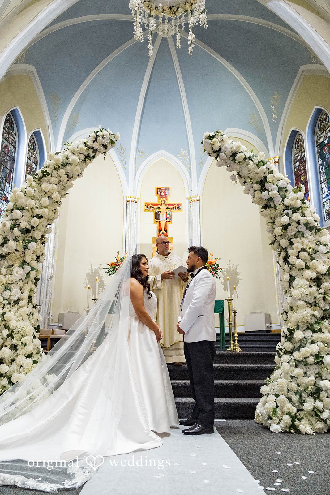 September 12, 2026 – Sierra & Arturo – (ID-4123) Sierra and Arturo under the floral arch at the altar