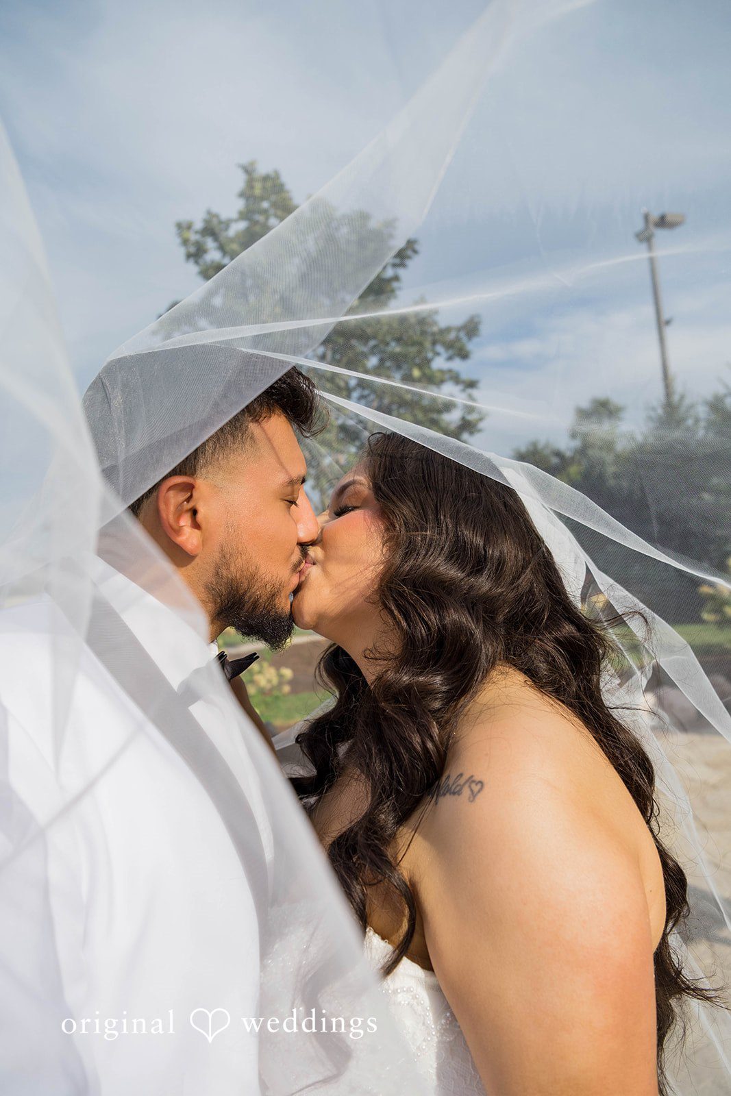September 12, 2026 – Sierra & Arturo – (ID-4123) Bride and groom kissing under the veil