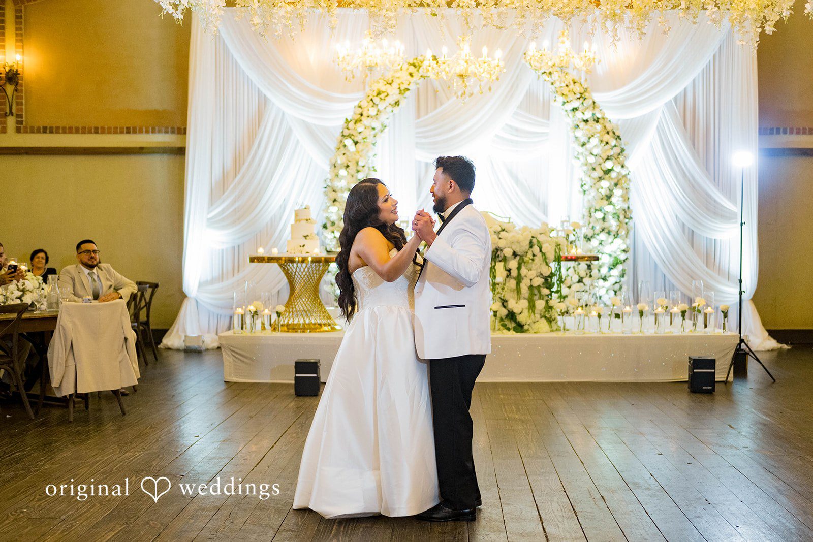 September 12, 2026 – Sierra & Arturo – (ID-4123) First dance under the floral backdrop at Rancho Los Guzman