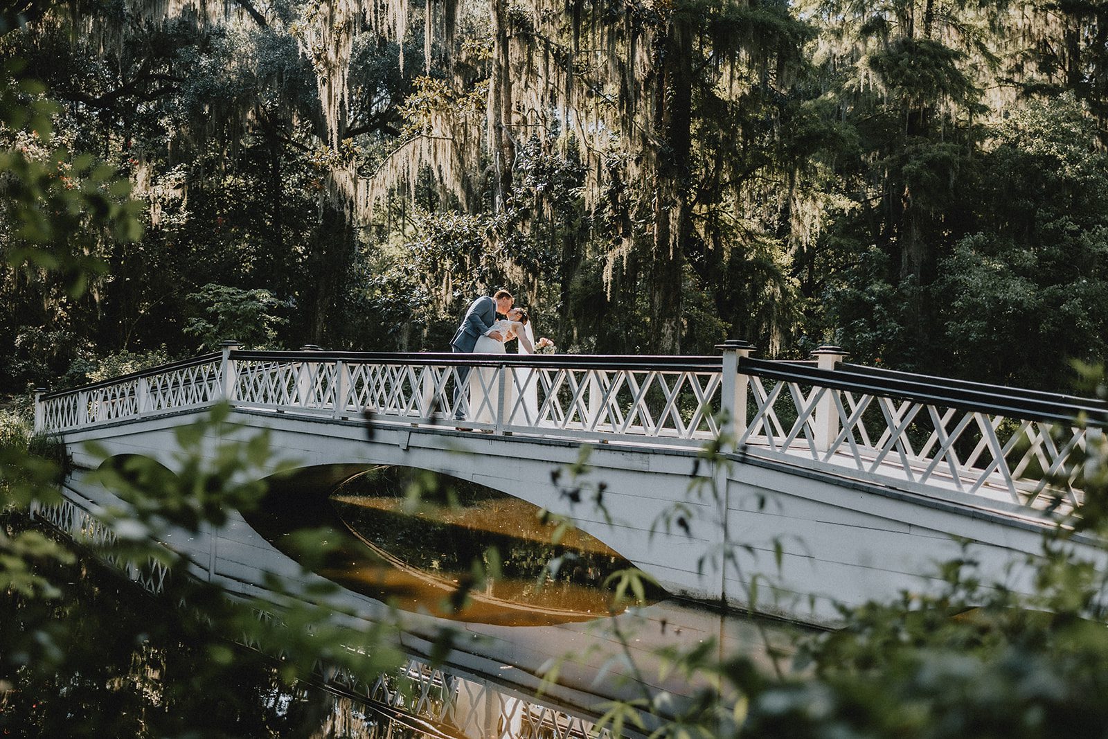 White bridge over the water at Magnolia Plantation and Gardens White bridge over the water at Magnolia Plantation and Gardens