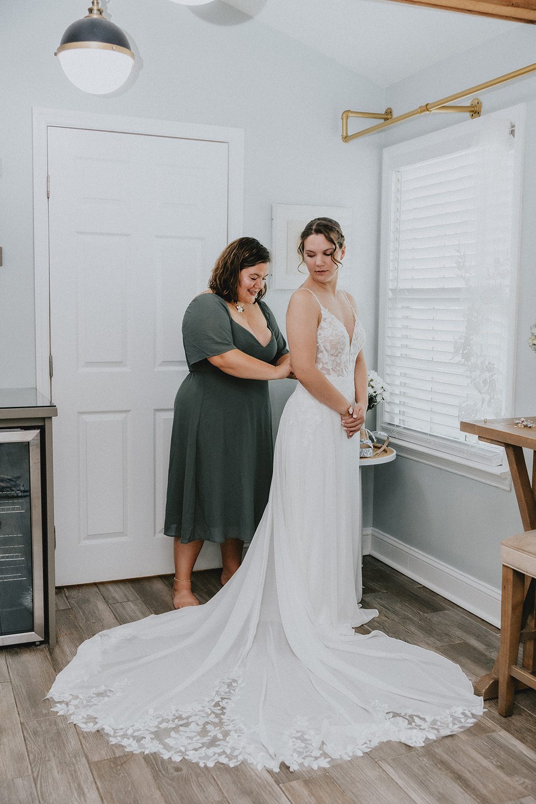 Bride getting ready with help Bride getting ready with help