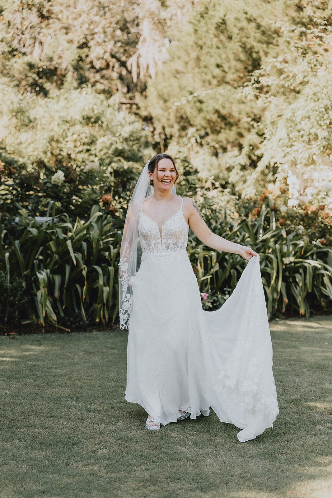 Bride with her veil in the garden at Magnolia Plantation and Gardens Bride with her veil in the garden at Magnolia Plantation and Gardens