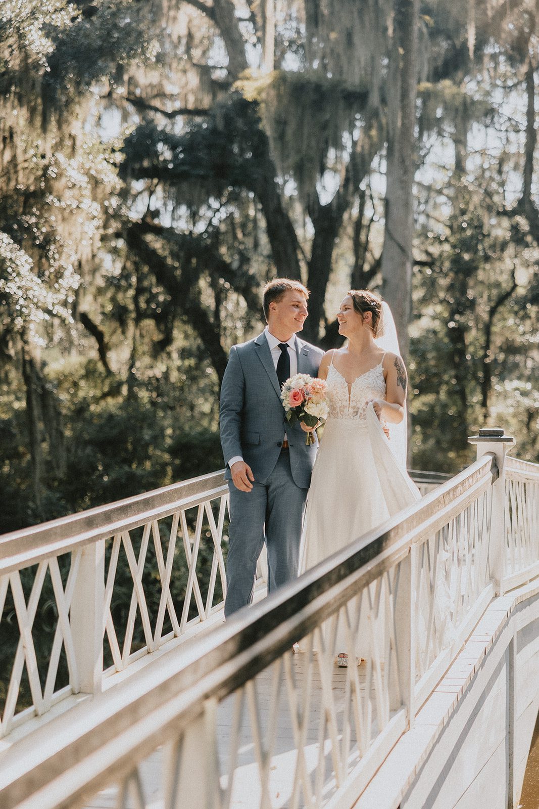 Couple on the white bridge at Magnolia Plantation and Gardens Couple on the white bridge at Magnolia Plantation and Gardens